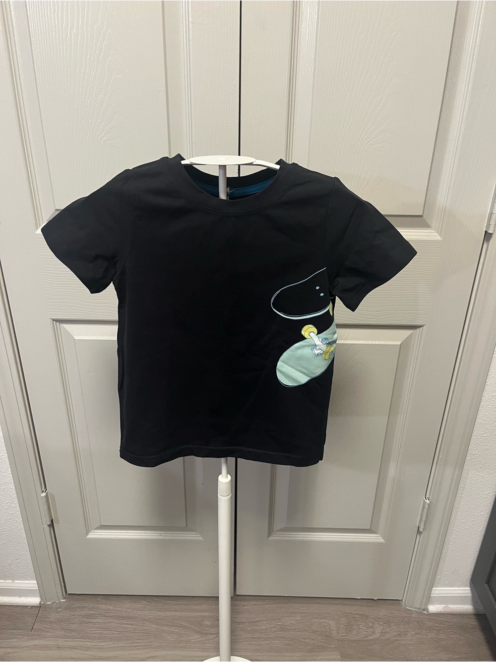 Kick Flip Tee! Black Short-Sleeve Kids Tee with Mint Skate Graphic